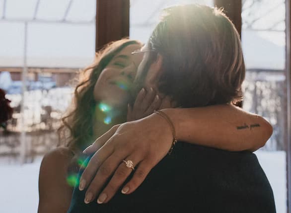 Louis and Camille embracing